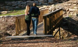 Couple Crossing a Bridge