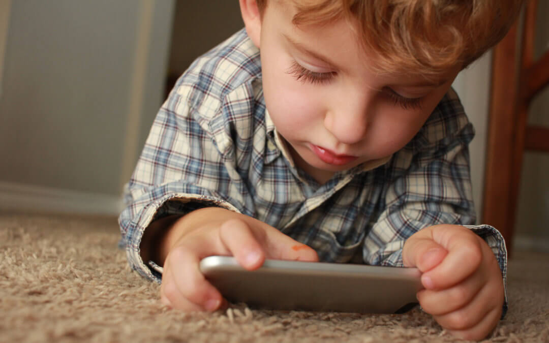Child with Electronic Device